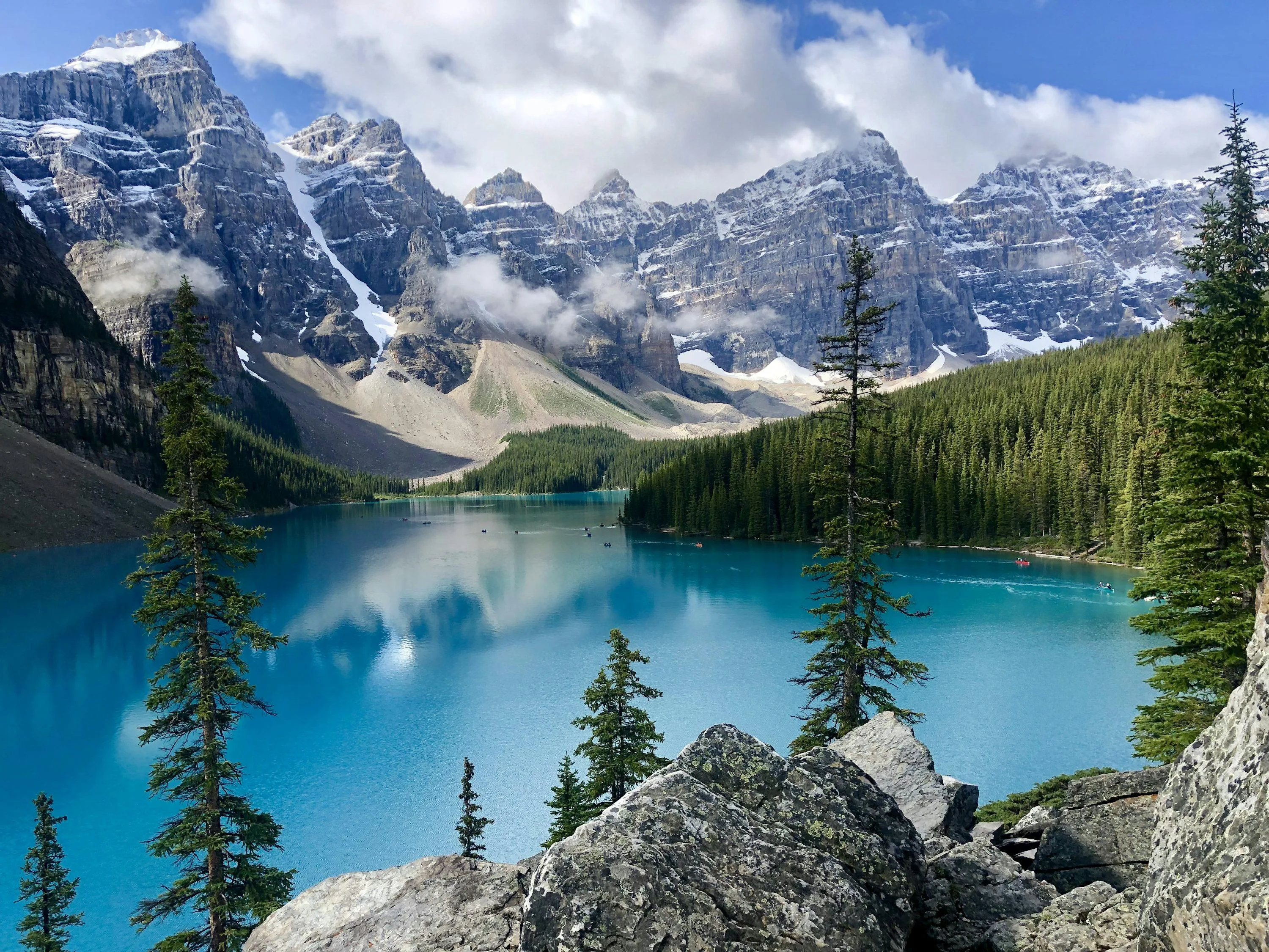 Turquoise waters of Lake Louise surrounded by mountain peaks in Banff National Park, Canada