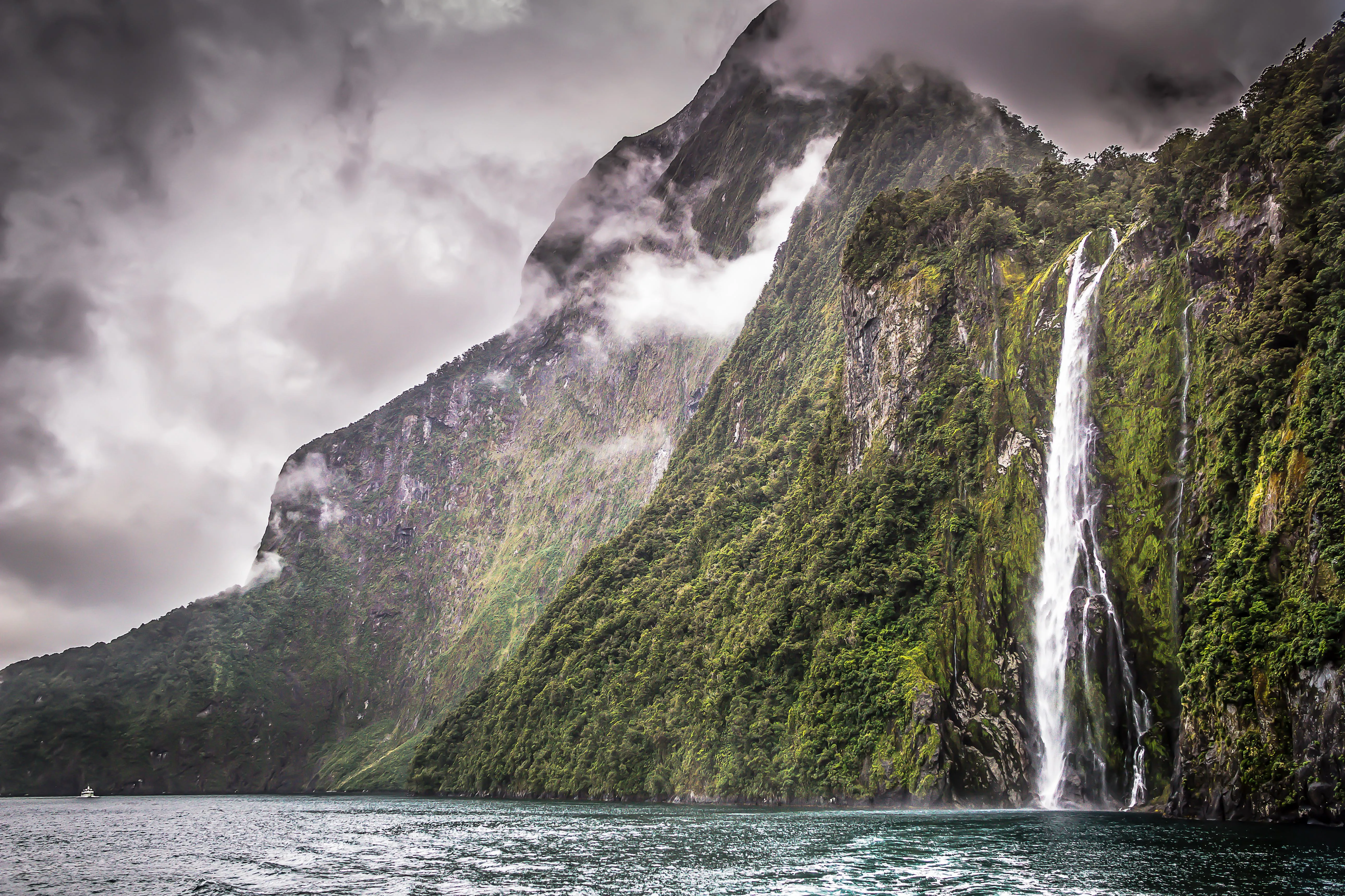Dramatic cliffs and waterfalls of Milford Sound in Fiordland National Park, New Zealand
